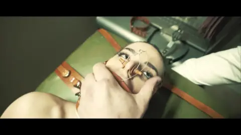 Blonde in prison cell gets face fucked in medical room with restraints