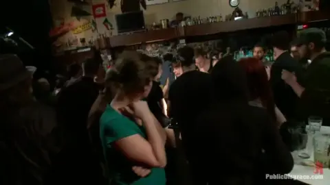 Brunette with tattoos gets blowjob and tied up in dim-lit club room